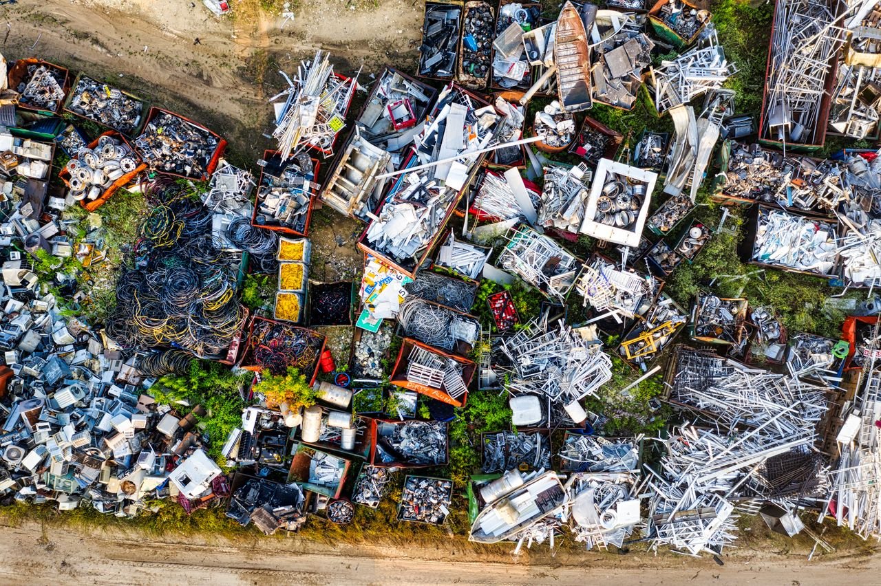 Aerial shot showcasing diverse scrap metal piles in a Saint Charles junkyard.